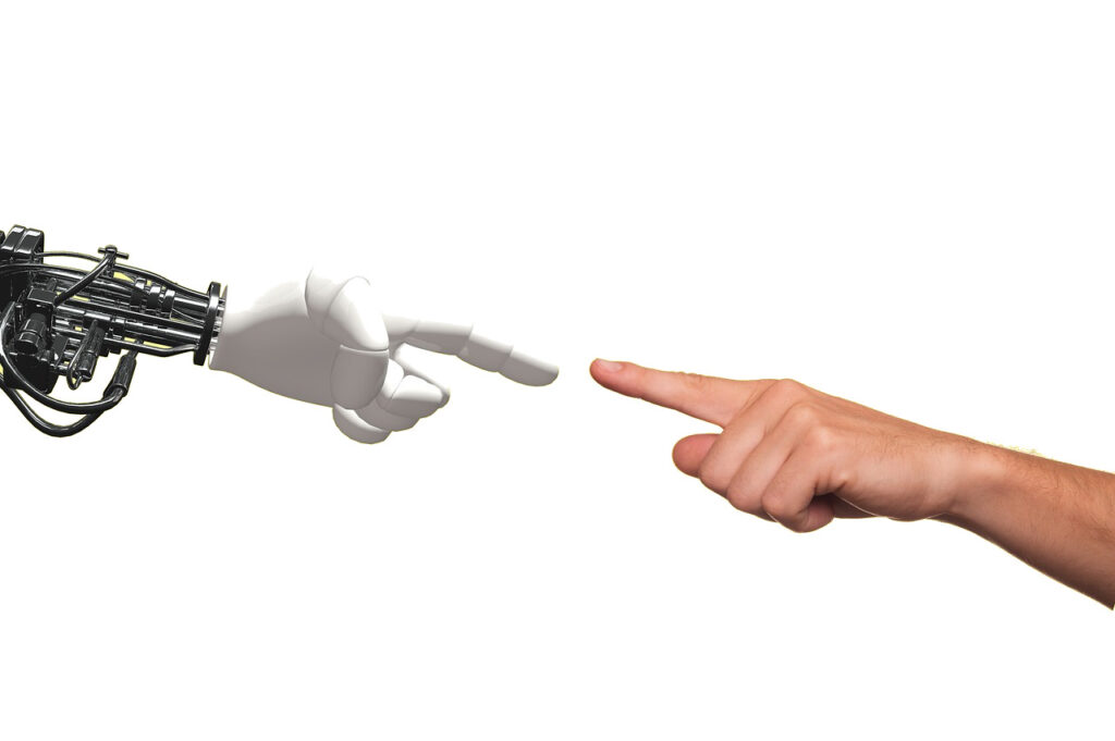 robottikäsi ja ihmisen käsi. kuva: tumisu, pixabay lisenssi.